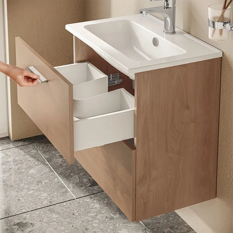 Dettaglio cassetti soft-close mobile bagno finitura rovere dorato